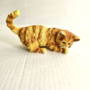 Vintage cat figurine yellow orange ceramic green eyes 7 inches long